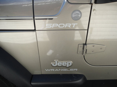 jeep wrangler 2004 beige suv sport gasoline 6 cylinders 4 wheel drive 5 speed manual 45005