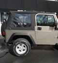 jeep wrangler 2004 beige suv sport gasoline 6 cylinders 4 wheel drive 5 speed manual 45005