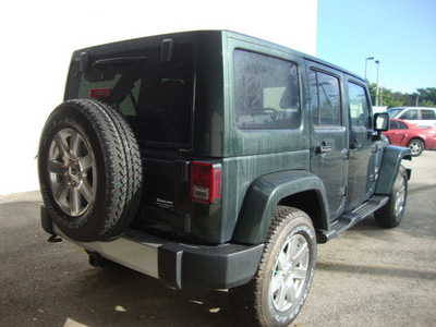 jeep wrangler unlimited 2012 green suv sahara gasoline 6 cylinders 4 wheel drive automatic 33157