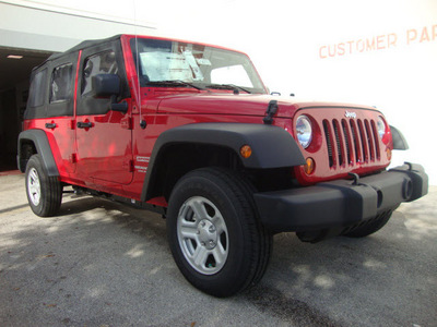 jeep wrangler unlimited 2012 red suv sport gasoline 6 cylinders 4 wheel drive automatic 33157