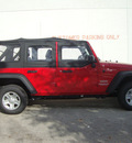 jeep wrangler unlimited 2012 red suv sport gasoline 6 cylinders 4 wheel drive automatic 33157