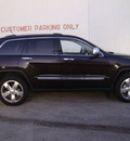 jeep grand cherokee 2011 dk  gray suv overland gasoline 6 cylinders 4 wheel drive automatic 33157