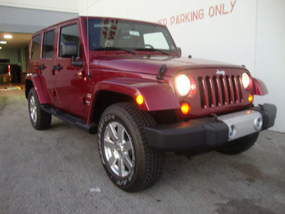jeep wrangler unlimited 2012 red suv sahara gasoline 6 cylinders 4 wheel drive automatic 33157