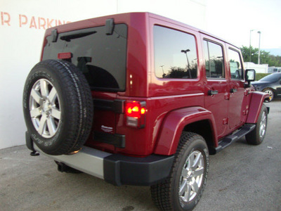 jeep wrangler unlimited 2012 red suv sahara gasoline 6 cylinders 4 wheel drive automatic 33157