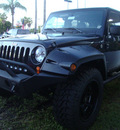 jeep wrangler unlimited 2011 black suv sport gasoline 6 cylinders 4 wheel drive automatic 33157