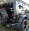 jeep wrangler unlimited 2011 black suv sport gasoline 6 cylinders 4 wheel drive automatic 33157