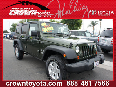 jeep wrangler unlimited 2009 green suv x gasoline 6 cylinders 4 wheel drive automatic 91761