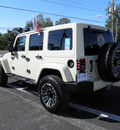 jeep wrangler unlimited 2011 tan suv sahara gasoline 6 cylinders 4 wheel drive automatic 32447