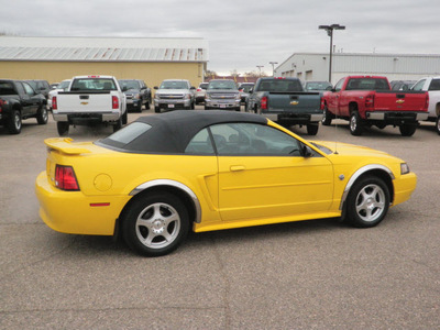 ford mustang 2004 yellow deluxe gasoline 6 cylinders rear wheel drive automatic with overdrive 55318