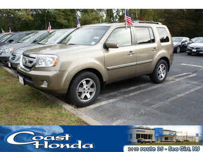 honda pilot 2009 beige suv touring w navi w dvd gasoline 6 cylinders all whee drive automatic with overdrive 08750