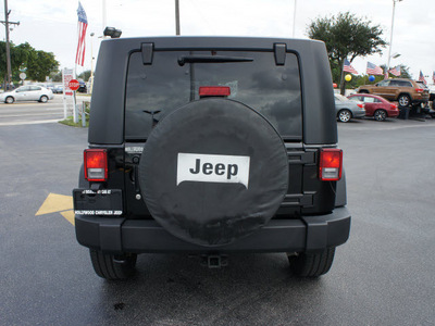 jeep wrangler unlimited 2010 black suv sport gasoline 6 cylinders 4 wheel drive automatic 33021