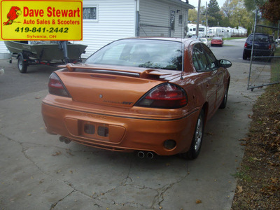 pontiac grand am 2004 orange sedan gt gasoline 6 cylinders front wheel drive automatic 43560