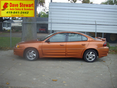 pontiac grand am 2004 orange sedan gt gasoline 6 cylinders front wheel drive automatic 43560