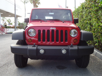 jeep wrangler unlimited 2011 red suv sport gasoline 6 cylinders 4 wheel drive automatic 33157