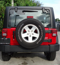jeep wrangler unlimited 2011 red suv sport gasoline 6 cylinders 4 wheel drive automatic 33157