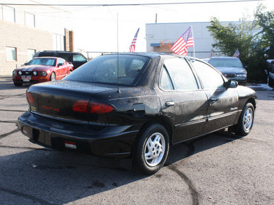 pontiac sunfire 1999 black sedan se gasoline 4 cylinders front wheel drive automatic 80229