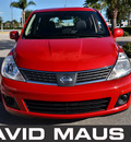 nissan versa 2007 red hatchback sl gasoline 4 cylinders front wheel drive automatic 32771