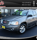 gmc envoy 2006 beige suv sle gasoline 6 cylinders 4 wheel drive automatic with overdrive 07735