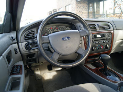 ford taurus 2007 light blue sedan sel gasoline 6 cylinders front wheel drive automatic 60098