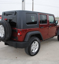jeep wrangler unlimited 2010 red suv sport gasoline 6 cylinders 4 wheel drive automatic with overdrive 76087