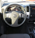 nissan frontier 2009 white se v6 gasoline 6 cylinders 2 wheel drive automatic with overdrive 76018