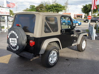 jeep wrangler 2006 black suv x gasoline 6 cylinders 4 wheel drive 6 speed manual 33021