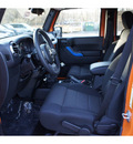 jeep wrangler unlimited 2012 orange suv sport gasoline 6 cylinders 4 wheel drive 6 speed manual 08844