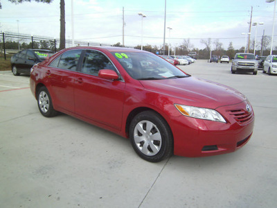 toyota camry 2009 red sedan le gasoline 4 cylinders front wheel drive automatic 75503