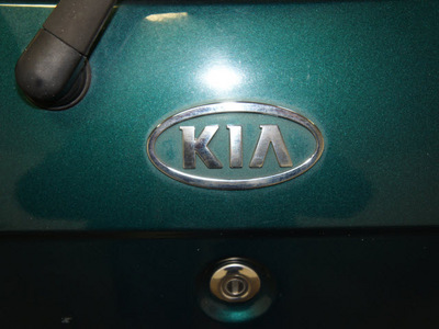 kia sedona 2005 dk  green van ex gasoline 6 cylinders front wheel drive automatic with overdrive 76108