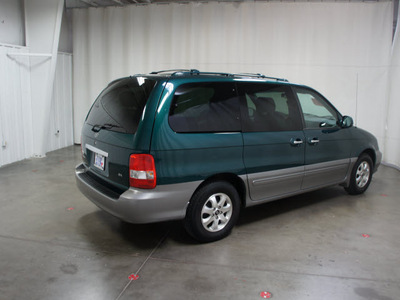 kia sedona 2005 dk  green van ex gasoline 6 cylinders front wheel drive automatic with overdrive 76108