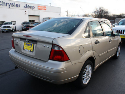 ford focus 2006 gold sedan zx4 se gasoline 4 cylinders front wheel drive automatic with overdrive 07730