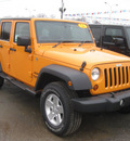jeep wrangler unlimited 2012 orange suv sport gasoline 6 cylinders 4 wheel drive 5 speed automatic 62863