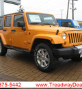 jeep wrangler unlimited 2012 orange suv sahara gasoline 6 cylinders 4 wheel drive automatic 45840