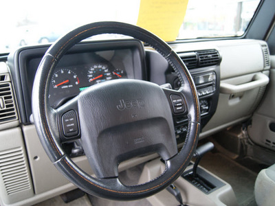 jeep wrangler 2003 tan suv sahara gasoline 6 cylinders 4 wheel drive automatic 61008