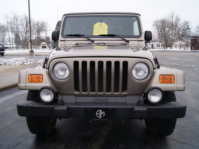 jeep wrangler 2003 tan suv sahara gasoline 6 cylinders 4 wheel drive automatic 61008