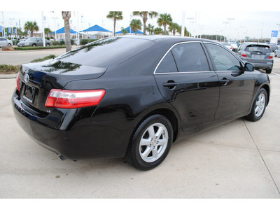 toyota camry 2009 black sedan le gasoline 4 cylinders front wheel drive automatic 77065