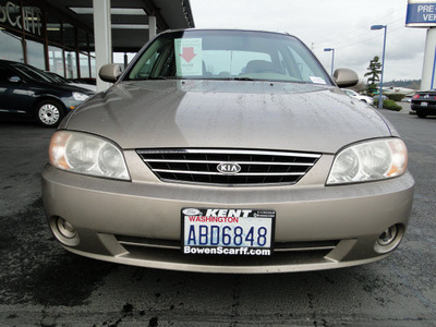 kia spectra 2003 gold sedan gasoline 4 cylinders dohc front wheel drive 5 speed manual 98032