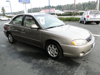 kia spectra 2003 gold sedan gasoline 4 cylinders dohc front wheel drive 5 speed manual 98032