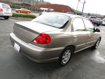 kia spectra 2003 gold sedan gasoline 4 cylinders dohc front wheel drive 5 speed manual 98032