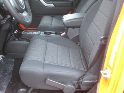 jeep wrangler unlimited 2012 orange suv sahara gasoline 6 cylinders 4 wheel drive 5 speed automatic 62863