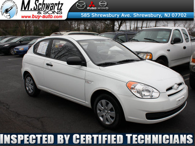 hyundai accent 2010 white hatchback blue gasoline 4 cylinders front wheel drive 5 speed manual 07702