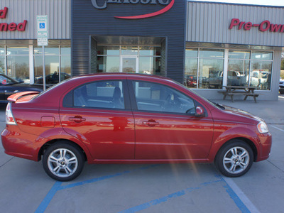 chevrolet aveo 2011 red sedan lt gasoline 4 cylinders front wheel drive automatic 76210
