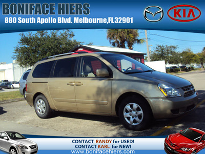 kia sedona 2010 gold van lx gasoline 6 cylinders front wheel drive automatic 32901