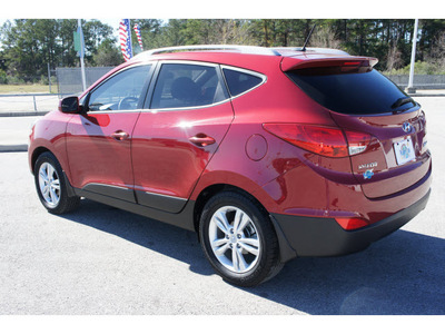 hyundai tucson 2011 dk  red gls gasoline 4 cylinders front wheel drive automatic 77388