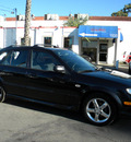 mazda protege5 2003 black hatchback gasoline 4 cylinders dohc front wheel drive 5 speed with overdrive 92882