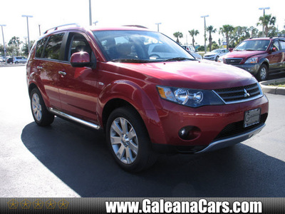 mitsubishi outlander 2009 red suv se gasoline 4 cylinders front wheel drive automatic 33912