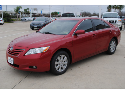 toyota camry 2007 red sedan xle v6 gasoline 6 cylinders front wheel drive autostick 77065