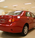 toyota corolla 2009 red sedan le gasoline 4 cylinders front wheel drive automatic 27707