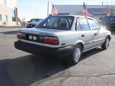 toyota corolla 1990 silver sedan deluxe gasoline 4 cylinders front wheel drive 5 speed manual 80229
