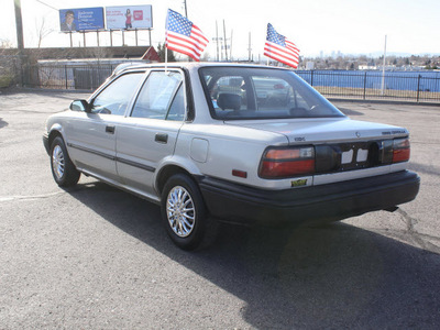 toyota corolla 1990 silver sedan deluxe gasoline 4 cylinders front wheel drive 5 speed manual 80229